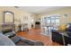 Open living room featuring hardwood floors, comfortable seating, and plenty of natural light at 7701 Starkey Rd # 526, Seminole, FL 33777