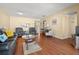 Bright living room with hardwood floors, comfortable seating, and an open layout at 7701 Starkey Rd # 526, Seminole, FL 33777