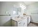 Bright bathroom featuring double vanity with granite countertops at 7735 Wauchula Rd, Myakka City, FL 34251