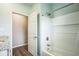 Bathroom featuring a tiled shower with a built-in shelf and a modern shower head at 7735 Wauchula Rd, Myakka City, FL 34251