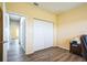 Bedroom showcasing closet, wood-look floors, and natural light at 7735 Wauchula Rd, Myakka City, FL 34251