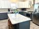 Modern kitchen featuring granite countertops, stainless steel appliances and stylish island at 7735 Wauchula Rd, Myakka City, FL 34251