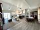 Open-concept living room with modern kitchen, dining area, and comfortable seating at 7735 Wauchula Rd, Myakka City, FL 34251