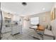 Dining area with built-in bench seating and a wooden table, adjacent to the modern kitchen at 774 29Th N Ave, St Petersburg, FL 33704