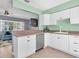 Well-lit kitchen connected to the living area, featuring modern appliances and countertops at 7882 42Nd N Ave, St Petersburg, FL 33709