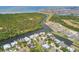 Stunning aerial view of waterfront homes surrounded by canals and lush greenery at 824 Islebay Dr, Apollo Beach, FL 33572
