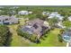 Beautiful aerial view of this community, highlighting the pool, patio, and lush yard at 824 Islebay Dr, Apollo Beach, FL 33572