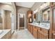 This bathroom shows a double sink vanity and a door that provides access to the toilet and shower at 824 Islebay Dr, Apollo Beach, FL 33572