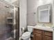 Bathroom featuring a modern shower with tile surround, toilet, and single sink vanity at 824 Islebay Dr, Apollo Beach, FL 33572
