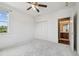 Bedroom with closet, carpet, ceiling fan, and an ensuite bathroom, ensuring a functional and comfortable area at 824 Islebay Dr, Apollo Beach, FL 33572