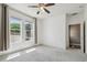Minimalist bedroom design offers natural light, neutral carpet, and ample closet space at 824 Islebay Dr, Apollo Beach, FL 33572