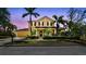 Charming two-story home with a well-manicured front yard and inviting curb appeal at 824 Islebay Dr, Apollo Beach, FL 33572