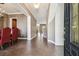 Open foyer with tile flooring, chandelier, and an inviting view into the dining and living areas at 824 Islebay Dr, Apollo Beach, FL 33572