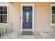 Close-up of a welcoming front door with a 'Welcome to Our Home' doormat at 824 Islebay Dr, Apollo Beach, FL 33572