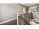 A second-story hallway shows wood flooring and an open view of the bathroom at 824 Islebay Dr, Apollo Beach, FL 33572