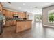 Open kitchen featuring wooden cabinetry, granite countertops, and stainless steel appliances at 824 Islebay Dr, Apollo Beach, FL 33572
