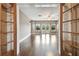 Bright living room featuring hardwood floors, a ceiling fan, and French doors leading to an outdoor area at 824 Islebay Dr, Apollo Beach, FL 33572