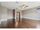 An open-concept living room with hardwood floors and a view into another room, perfect for entertaining at 824 Islebay Dr, Apollo Beach, FL 33572
