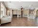 Spacious living room shows the fireplace, tiled floor, staircase and neutral color palette at 824 Islebay Dr, Apollo Beach, FL 33572