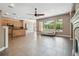 Spacious open concept living room with kitchen, fireplace, tile floors and view of lanai at 824 Islebay Dr, Apollo Beach, FL 33572