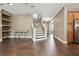 Open floor plan with stairs and tile flooring, adjacent to kitchen and living area at 824 Islebay Dr, Apollo Beach, FL 33572