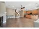 Open concept living room with tile floors, modern kitchen, and staircase to the second floor at 824 Islebay Dr, Apollo Beach, FL 33572