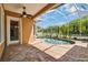 Relax by the refreshing screened-in pool with a covered patio and lush landscaping at 824 Islebay Dr, Apollo Beach, FL 33572