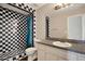 Modern bathroom with granite vanity top and stylish tile in shower at 8551 N Hyaleah Rd, Tampa, FL 33617
