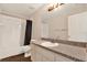 Well maintained bathroom with shower and tub combo and granite vanity top at 8551 N Hyaleah Rd, Tampa, FL 33617
