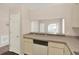 Functional kitchen featuring ample counter space, a modern dishwasher, and a convenient layout at 8551 N Hyaleah Rd, Tampa, FL 33617