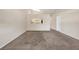Inviting living room with carpet, a kitchen view, and plenty of space for relaxation and entertaining at 8551 N Hyaleah Rd, Tampa, FL 33617