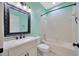 Bathroom with a large framed mirror, vanity, tile flooring, and shower-tub combo at 8714 Sandy Plains Dr, Riverview, FL 33578