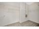 Walk-in closet featuring carpeted floor and white shelving at 8714 Sandy Plains Dr, Riverview, FL 33578