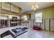 Open kitchen featuring hanging cabinets, block walls awaiting finishes, and tile floors at 9346 2Nd N St, St Petersburg, FL 33702