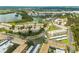 Aerial view of the community with buildings, lake, trees, and parking at 10039 62Nd N Ave # 14, St Petersburg, FL 33708