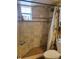 Elegant tiled shower with a built-in bench and recessed shelving for a spa-like experience at 10039 62Nd N Ave # 14, St Petersburg, FL 33708