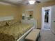 Comfortable bedroom featuring a king-size bed, ceiling fan, and natural light for a peaceful ambiance at 10039 62Nd N Ave # 14, St Petersburg, FL 33708