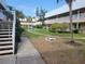 Courtyard view with mature landscaping and buildings in the background at 10039 62Nd N Ave # 14, St Petersburg, FL 33708