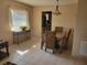 Bright dining area featuring tiled flooring, a table with seating for four, and natural light at 10039 62Nd N Ave # 14, St Petersburg, FL 33708