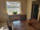 Cozy dining area with woven chairs and natural light at 10039 62Nd N Ave # 14, St Petersburg, FL 33708