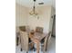 Charming dining room features a square table with seating for four at 10039 62Nd N Ave # 14, St Petersburg, FL 33708