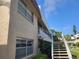 Exterior of building with stairway and second story balcony at 10039 62Nd N Ave # 14, St Petersburg, FL 33708