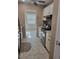 Updated kitchen has white cabinets, granite countertops, and stainless steel appliances and tile floors at 10039 62Nd N Ave # 14, St Petersburg, FL 33708
