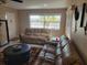 Bright living room with cozy seating and tile flooring at 10039 62Nd N Ave # 14, St Petersburg, FL 33708