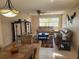Inviting living room featuring comfortable sofas, a ceiling fan, and a dining area in view at 10039 62Nd N Ave # 14, St Petersburg, FL 33708