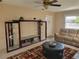 Comfortable living room with entertainment center and leather sofa at 10039 62Nd N Ave # 14, St Petersburg, FL 33708