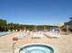 Community hot tub and pool area, with lounge chairs available for resident relaxation at 10039 62Nd N Ave # 14, St Petersburg, FL 33708