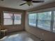 Bright sunroom with tiled floors and large windows, perfect for enjoying natural light and views at 10039 62Nd N Ave # 14, St Petersburg, FL 33708