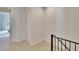 Upstairs hallway view featuring hall closet and carpet at 111 S Packwood Ave # A, Tampa, FL 33606