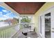 Balcony with seating offering a beautiful view of the neighborhood pond at 113 Seahorse Se Dr # D, St Petersburg, FL 33705